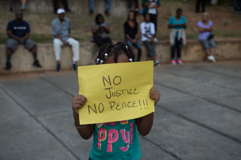 A little girl holds up a sign during a demonstration against police brutality in Charlotte, N.C., on Sept. 21, 2016, following the shooting of Keith Lamont Scott the previous day.Nicholas Kamm/AFP/Getty Images